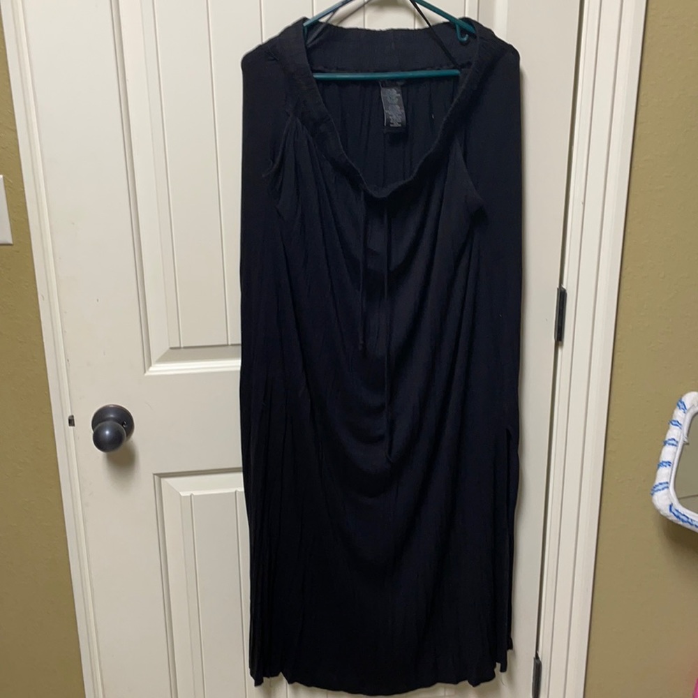 Long black skirt with pockets. Stretchy.